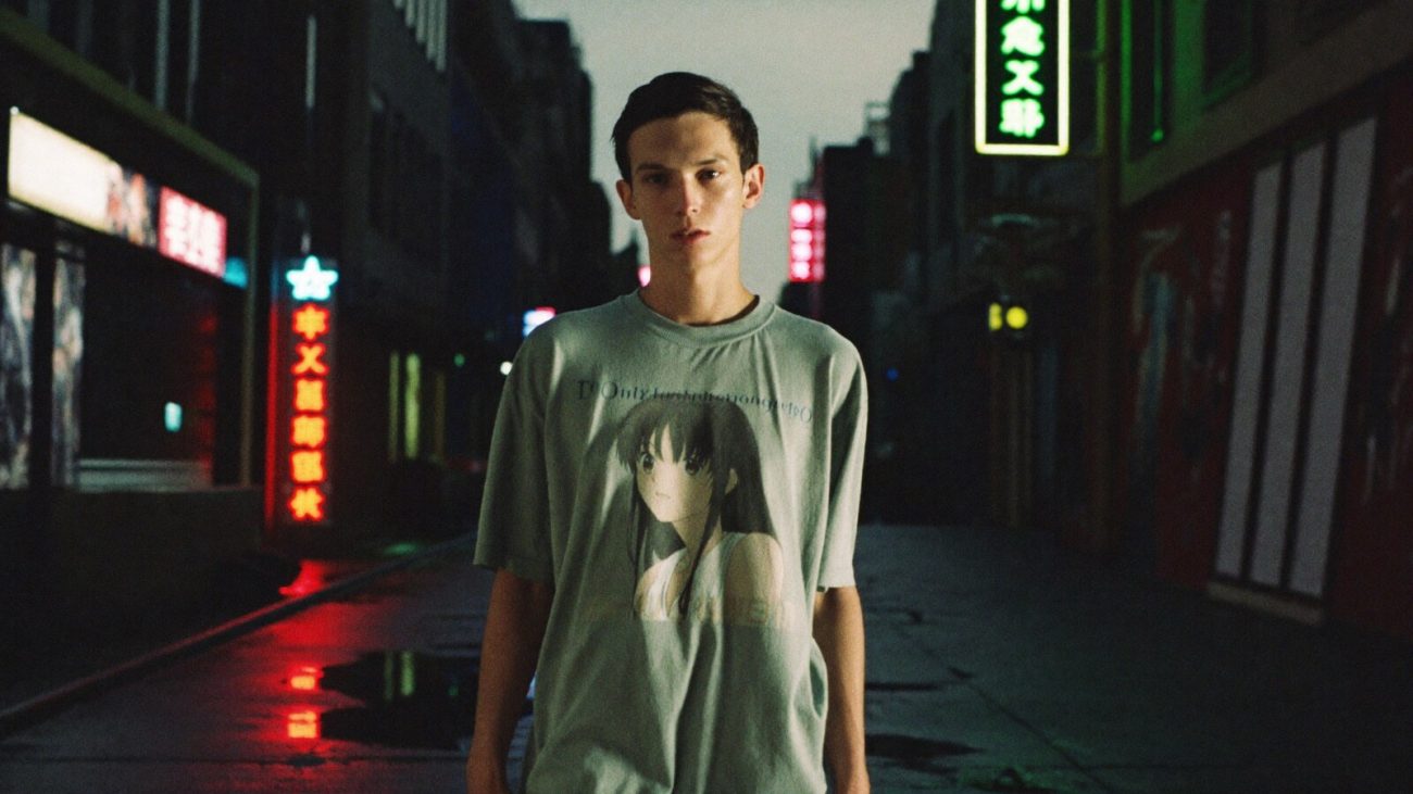 Person wearing an anime-inspired vintage t-shirts in an editorial scene