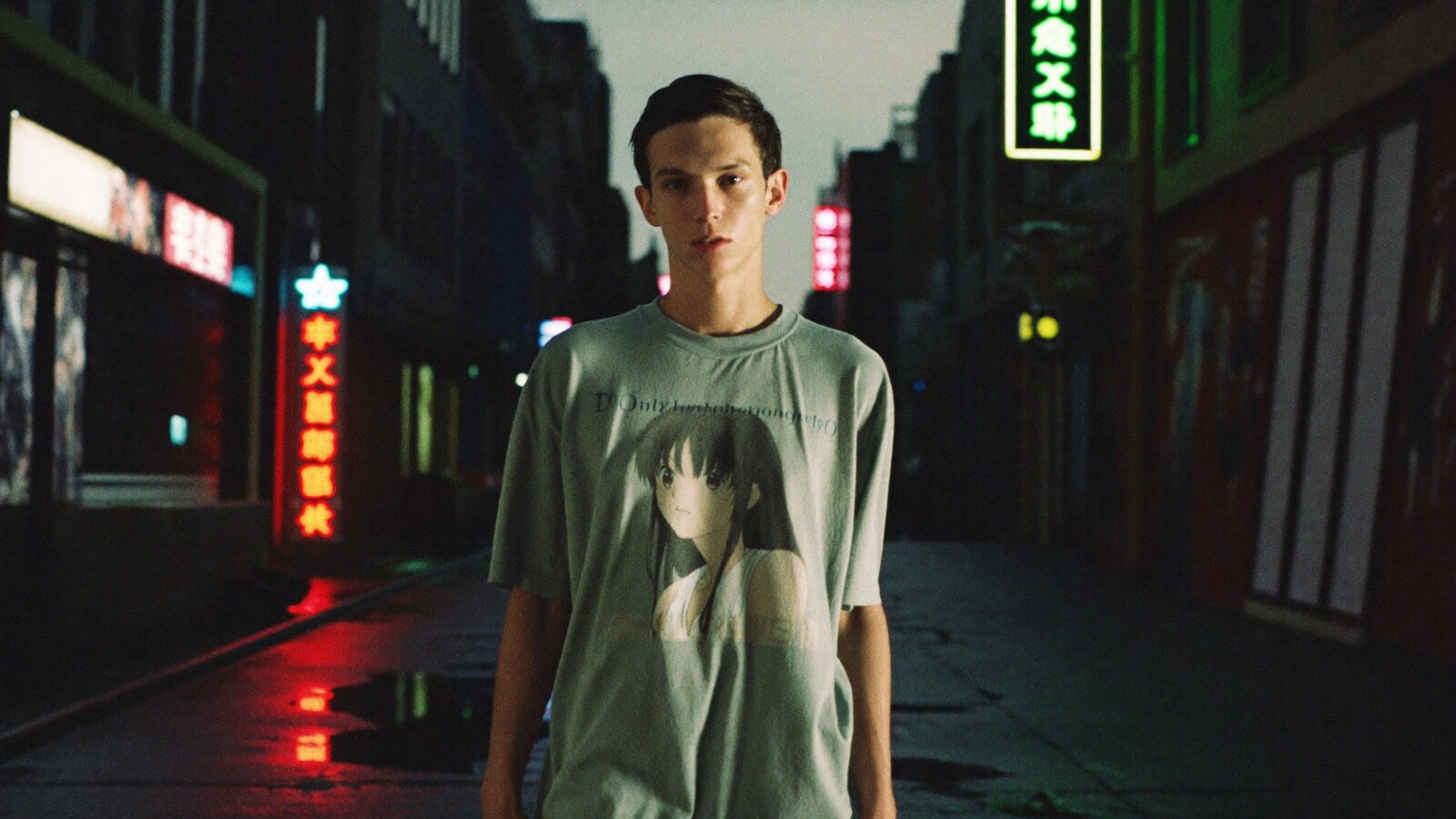 Person wearing an anime-inspired vintage t-shirts in an editorial scene