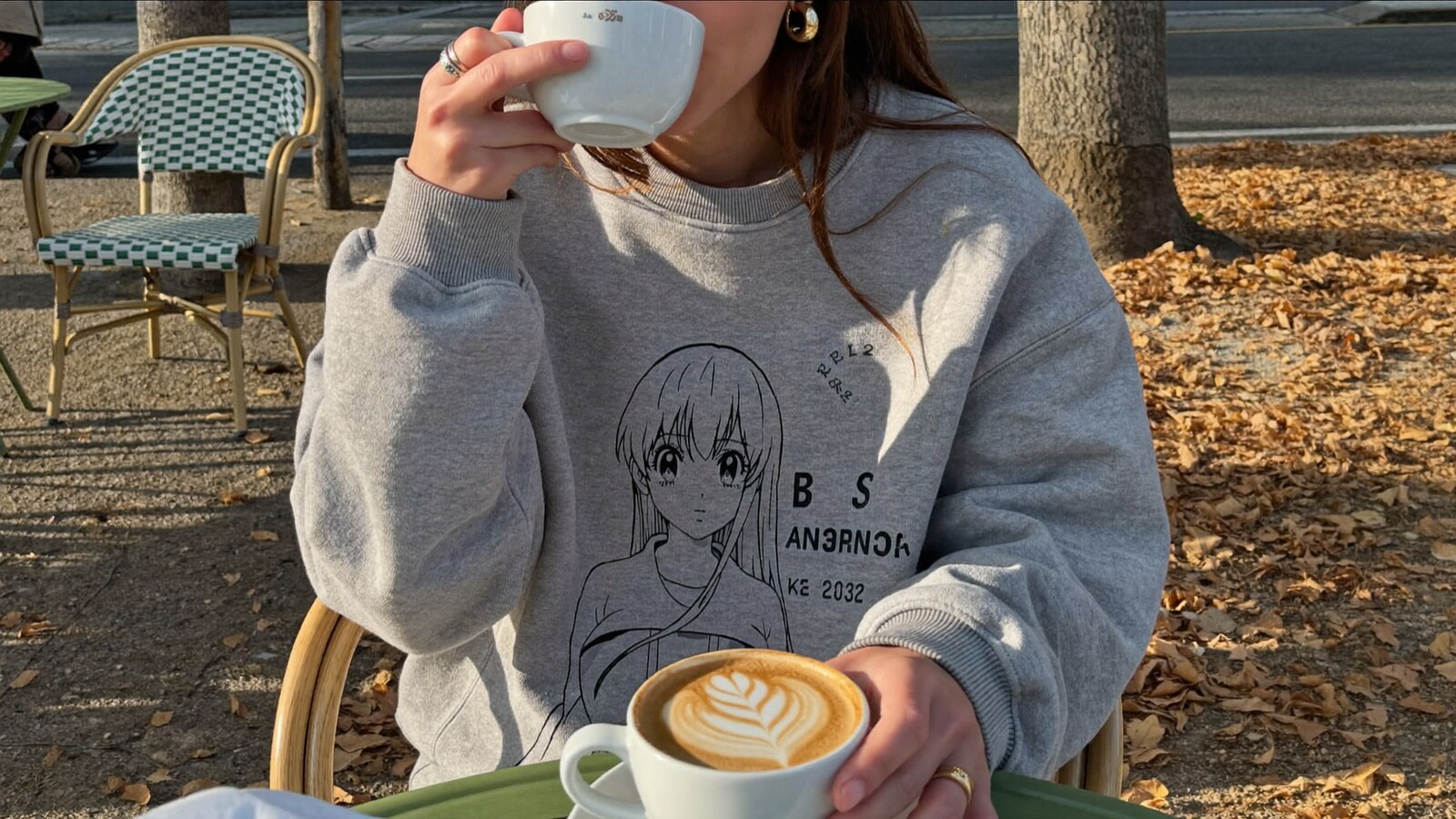 Anime-inspired vintage sweatshirts styled in a natural daylight scene