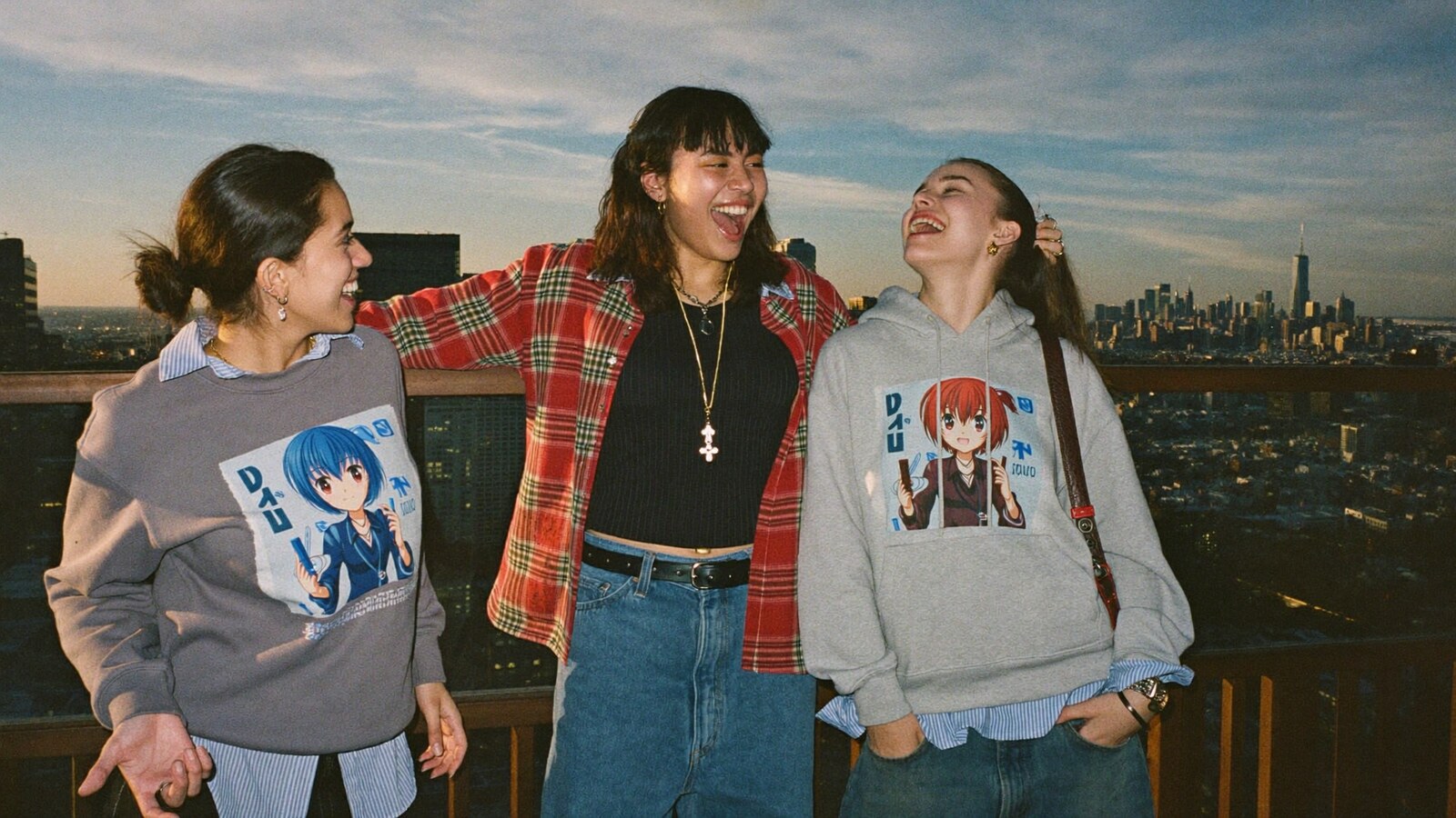 Anime-inspired vintage sweatshirts in a social or layered scene with friends