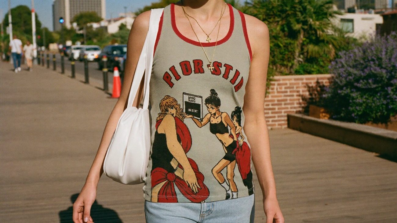 Person wearing an anime-inspired vintage tank tops in an editorial scene