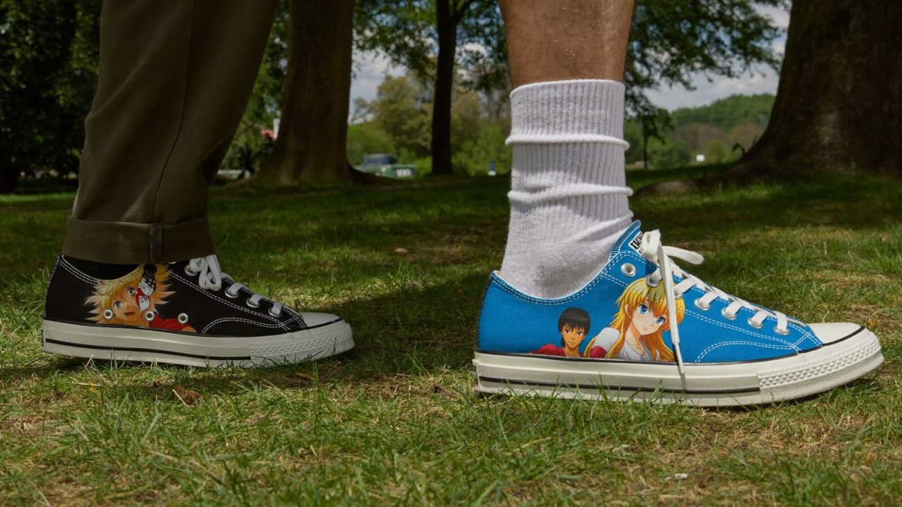 Person wearing an anime-inspired vs canvas shoes in an editorial scene