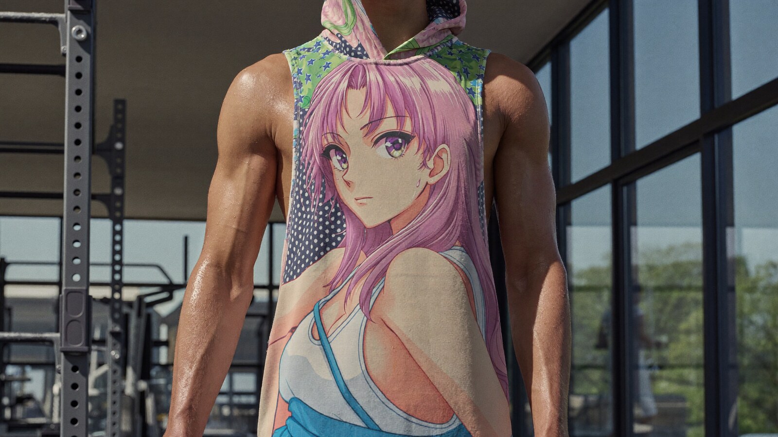 Person wearing an anime-inspired workout & sleeveless hoodies in an editorial scene