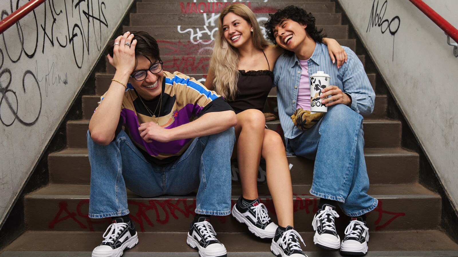 Anime-inspired yz shoes bw in a social or layered scene with friends