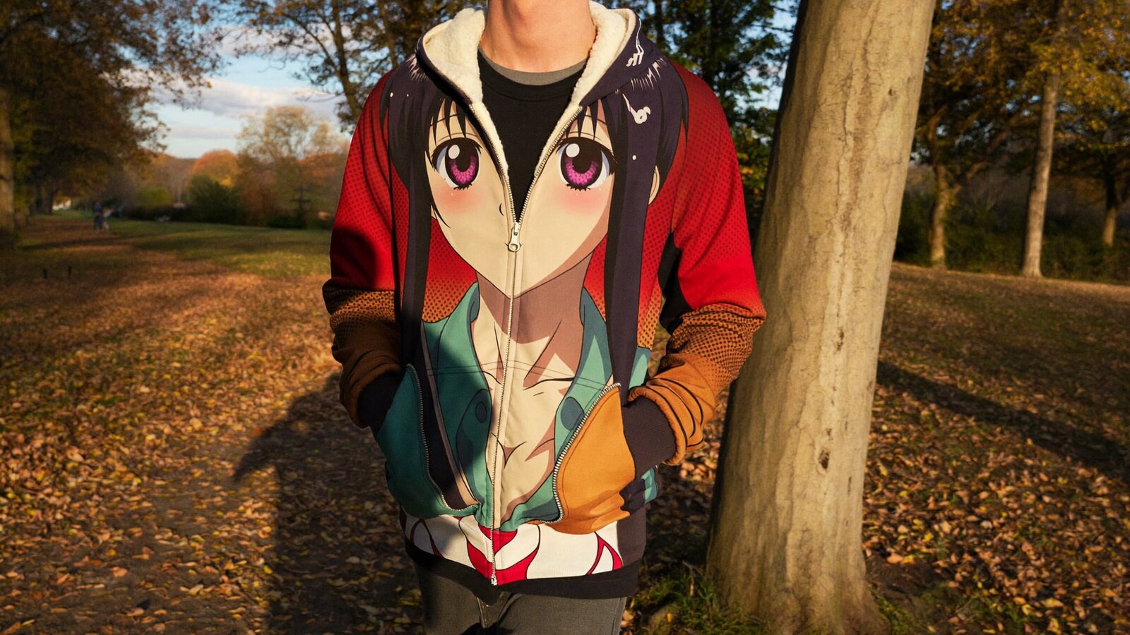 Anime-inspired zip hoodie jackets styled in a natural daylight scene