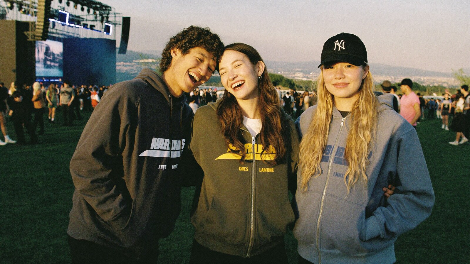 Anime-inspired zip hoodie jackets in a social or layered scene with friends