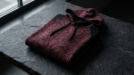 Jujutsu Kaisen Sukuna themed crimson and black apparel flat lay