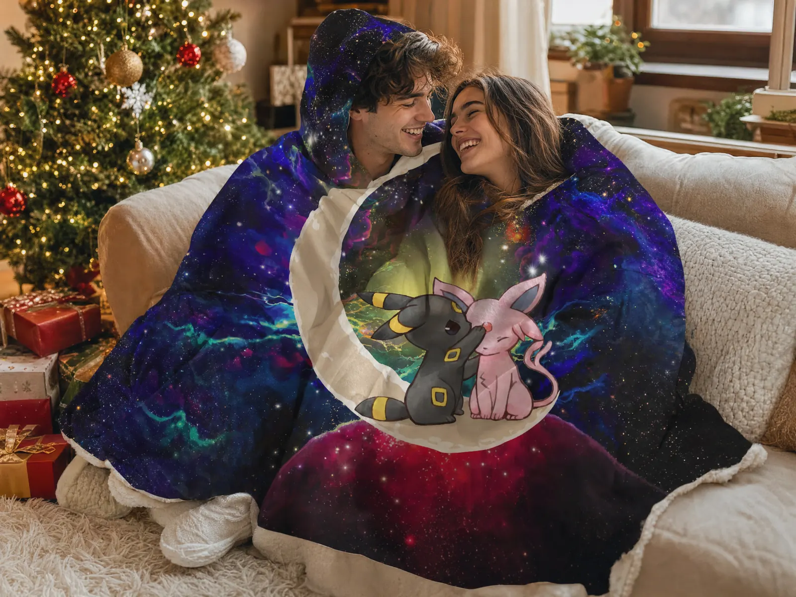 Couple on Christmas morning wrapped in Espeon and Umbreon Pokemon galaxy hooded blankets